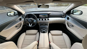 A stunning perspective from the back seats of a Mercedes E-Class Station Wagon W213, highlighting its modern, elegant white interior.